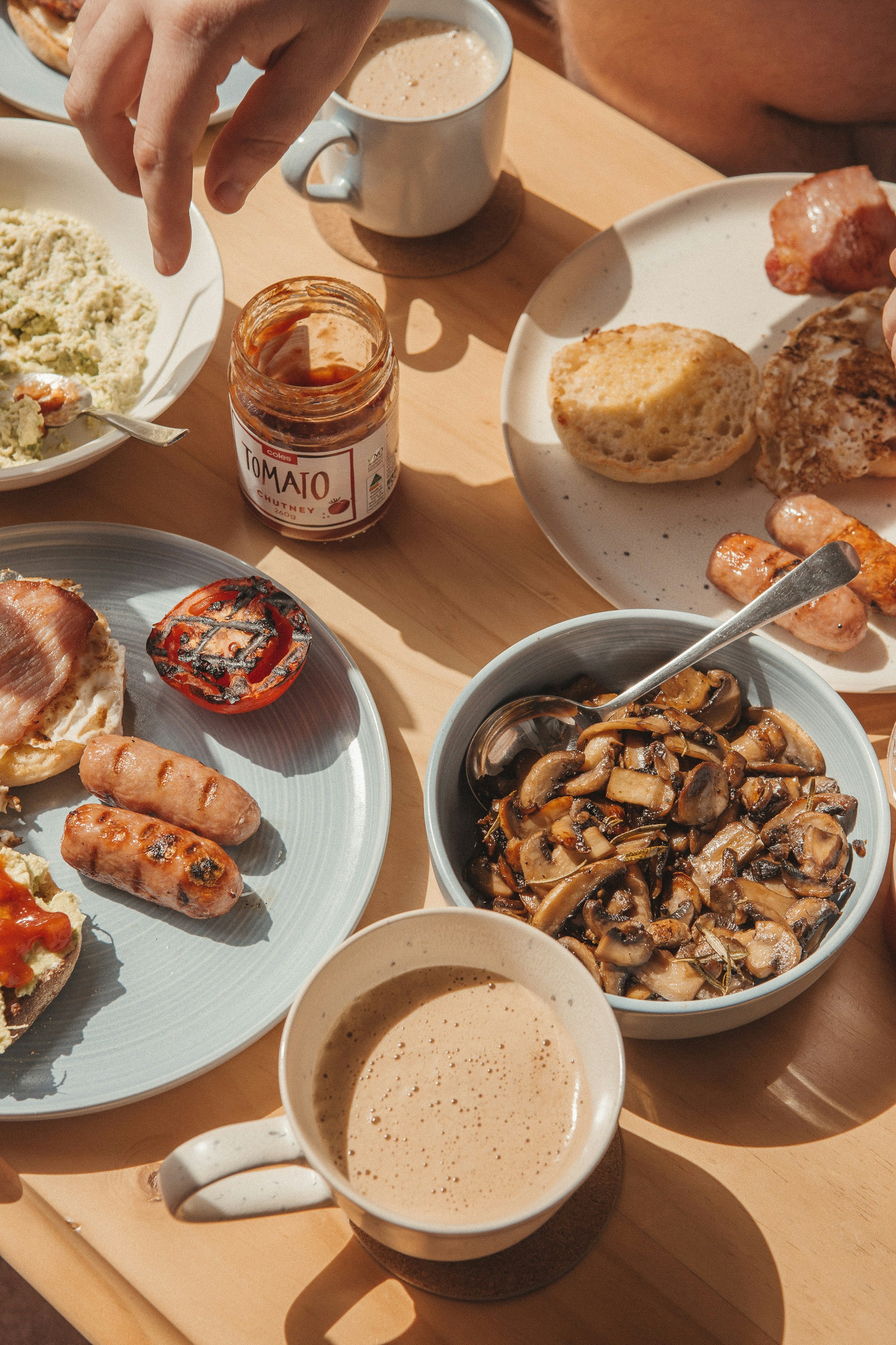 Golden brunch table spread with coffee and sausages